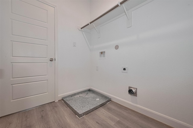 1611 Regents Gate Ct, Houston, TX 77055 - laundry area featuring hookup for an electric dryer, washer hookup, gas dryer hookup, light wood-type flooring, and baseboards