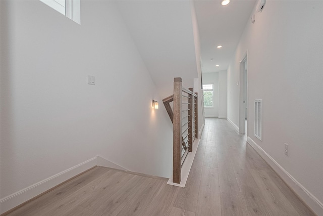 1611 Regents Gate Ct, Houston, TX 77055 - hallway with light wood-style flooring, an upstairs landing, recessed lighting, and baseboards
