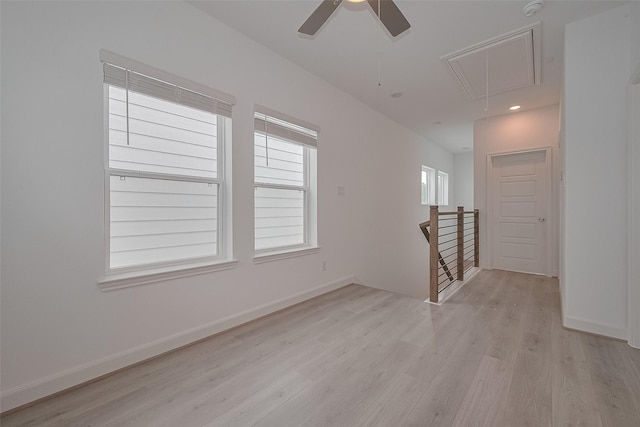 1611 Regents Gate Ct, Houston, TX 77055 - unfurnished room featuring attic access, light wood finished floors, ceiling fan, baseboards, and a smoke detector