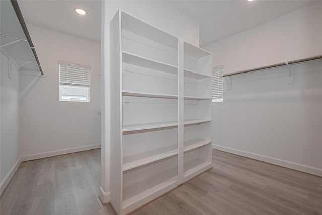 1611 Regents Gate Ct, Houston, TX 77055 - walk in closet featuring wood finished floors