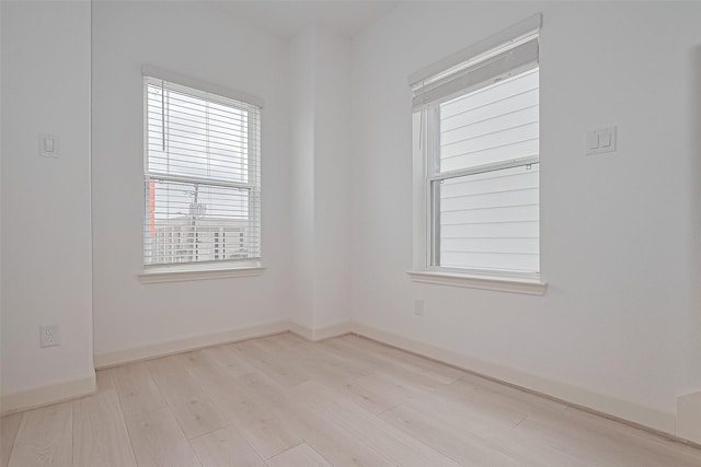 8928 Covenant Pl, Houston, TX 77055 - spare room featuring wood finished floors, plenty of natural light, and baseboards