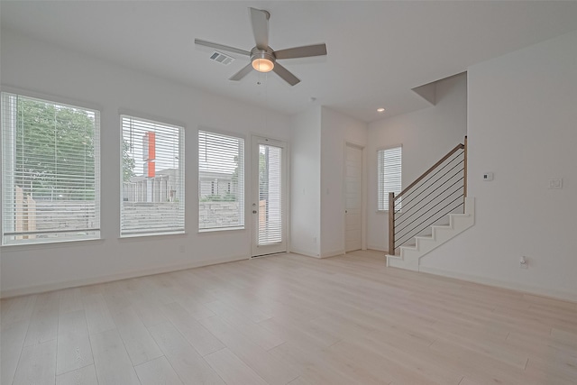 8928 Covenant Pl, Houston, TX 77055 - spare room with light wood-type flooring, a ceiling fan, stairs, baseboards, and recessed lighting