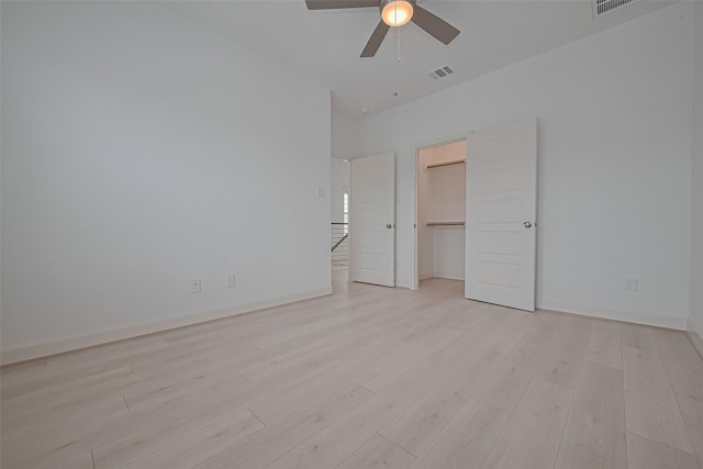 8928 Covenant Pl, Houston, TX 77055 - unfurnished bedroom with light wood-type flooring, a ceiling fan, baseboards, and a closet