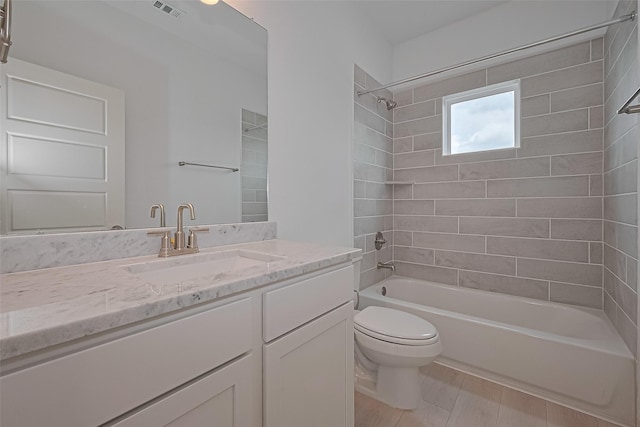 8928 Covenant Pl, Houston, TX 77055 - full bath featuring toilet, vanity, tub / shower combination, and wood finished floors