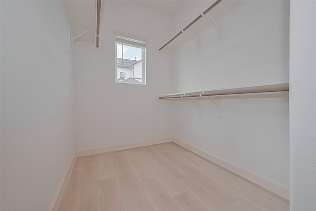 8928 Covenant Pl, Houston, TX 77055 - walk in closet featuring light wood finished floors