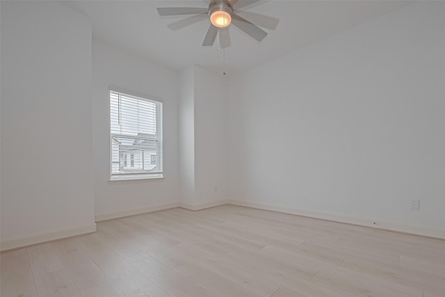 8928 Covenant Pl, Houston, TX 77055 - spare room with light wood finished floors, a ceiling fan, and baseboards