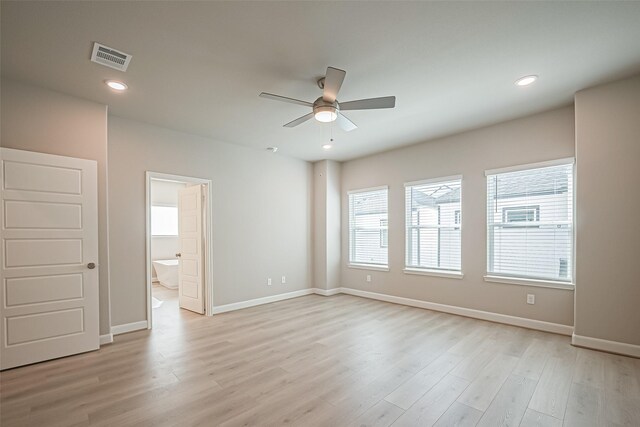 spare room with visible vents, baseboards, a ceiling fan, and light wood-type flooring