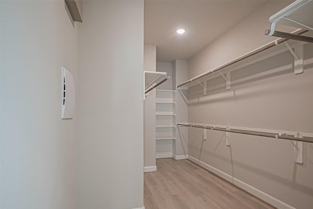 walk in closet featuring light wood-style floors
