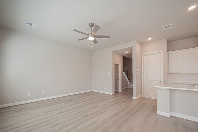unfurnished living room with light wood-style flooring, visible vents, ceiling fan, and recessed lighting