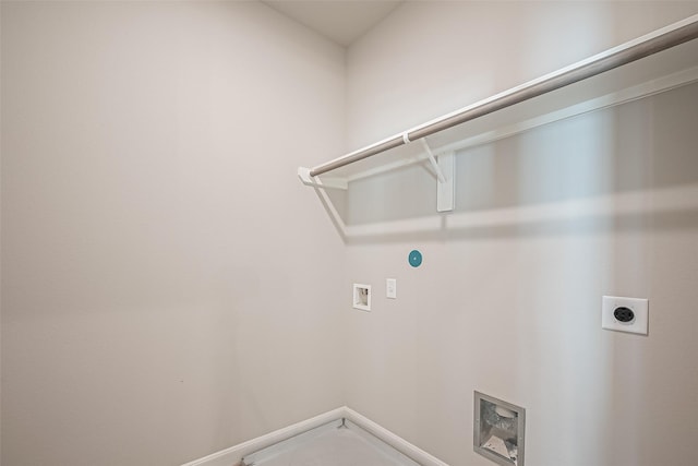 laundry area with baseboards, hookup for an electric dryer, hookup for a washing machine, and laundry area