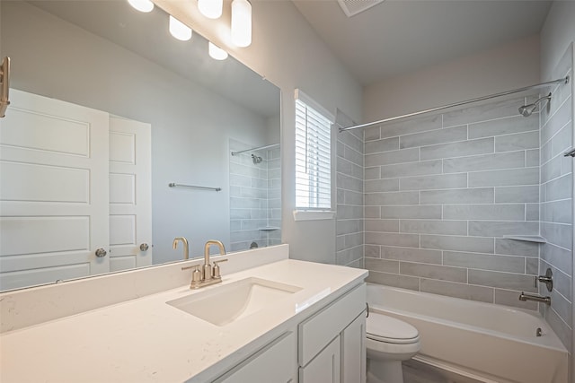 bathroom featuring toilet, vanity, shower / tub combination, and visible vents