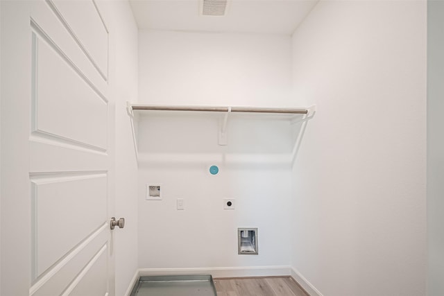 laundry room with laundry area, visible vents, hookup for an electric dryer, washer hookup, and light wood finished floors