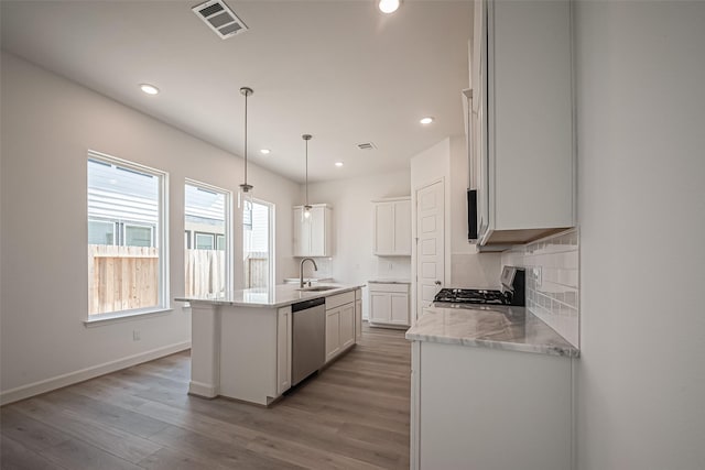 kitchen featuring range, stainless steel dishwasher, light wood-type flooring, recessed lighting, and a sink