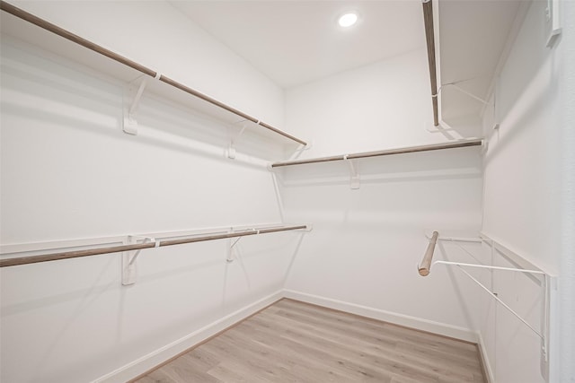 spacious closet with light wood-style floors