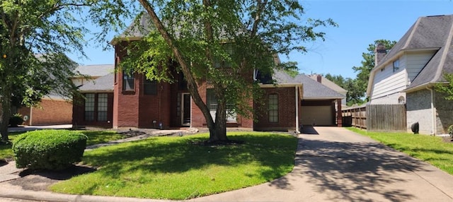3226 Blackcastle Dr, Houston, TX 77068 - obstructed view of property with brick siding, fence, a garage, concrete driveway, and a front yard