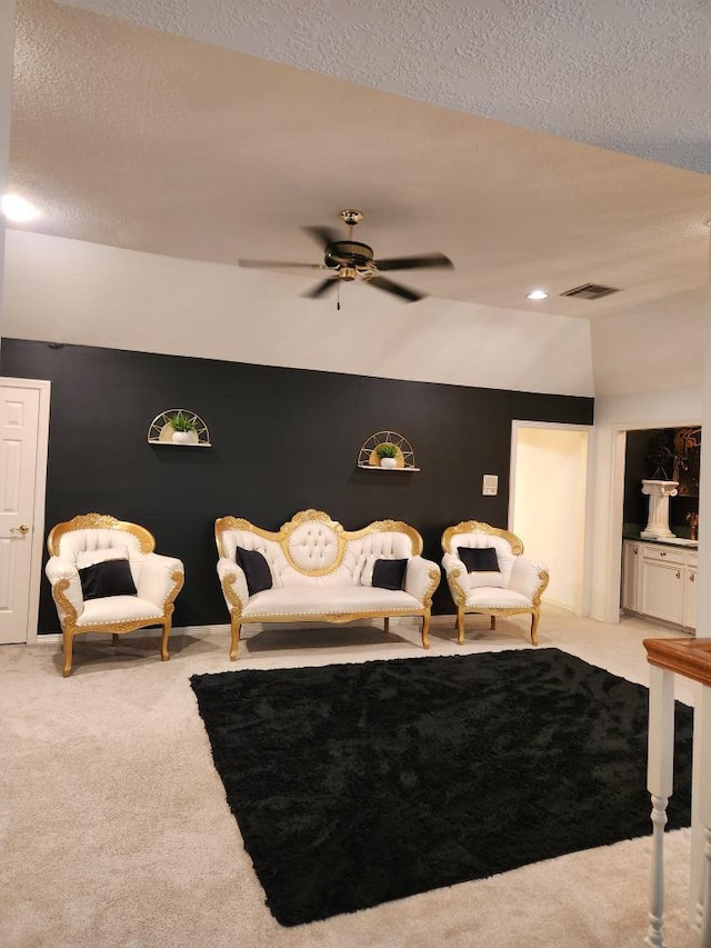 3226 Blackcastle Dr, Houston, TX 77068 - carpeted living room featuring a ceiling fan, visible vents, a textured ceiling, and vaulted ceiling