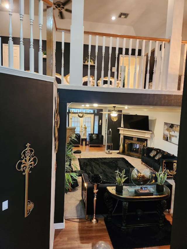 3226 Blackcastle Dr, Houston, TX 77068 - living room featuring a towering ceiling, a ceiling fan, visible vents, and wood finished floors