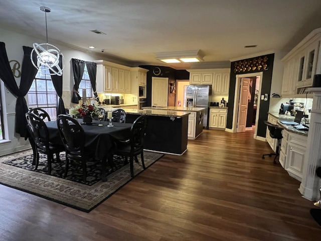 3226 Blackcastle Dr, Houston, TX 77068 - dining room with a notable chandelier, dark wood-style floors, and visible vents