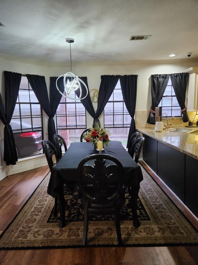 3226 Blackcastle Dr, Houston, TX 77068 - dining room with crown molding, recessed lighting, visible vents, and wood finished floors