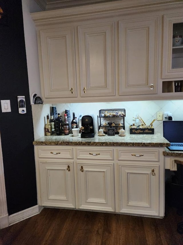 3226 Blackcastle Dr, Houston, TX 77068 - bar featuring decorative backsplash, baseboards, and dark wood-type flooring
