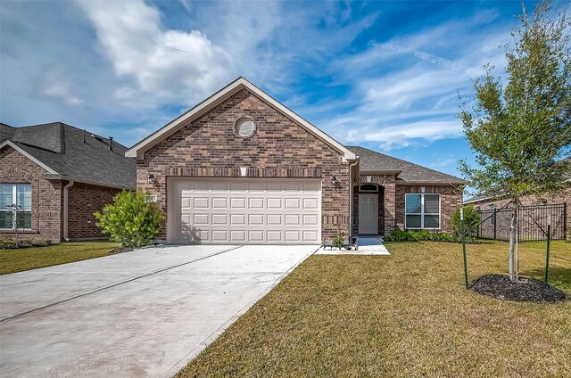 2203 Manila, Texas City, TX 77568 - single story home with a front yard, a garage, fence, concrete driveway, and brick siding