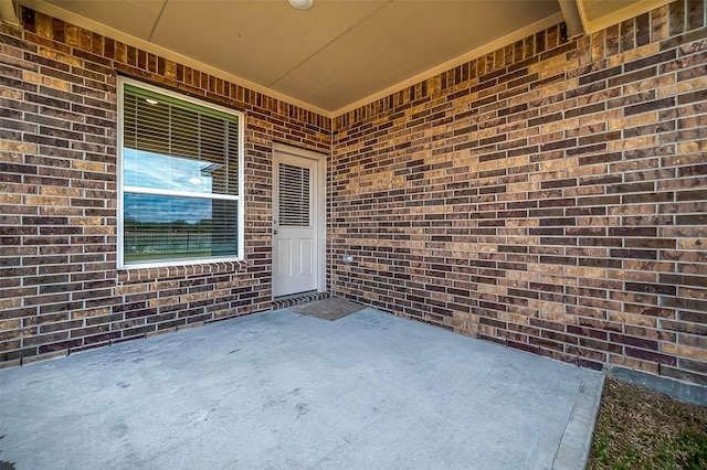 2203 Manila, Texas City, TX 77568 - property entrance with brick siding and a patio