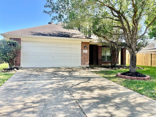 15318 Redbud Berry Way, Cypress, TX 77433 - single story home featuring a garage, fence, brick siding, driveway, and roof with shingles