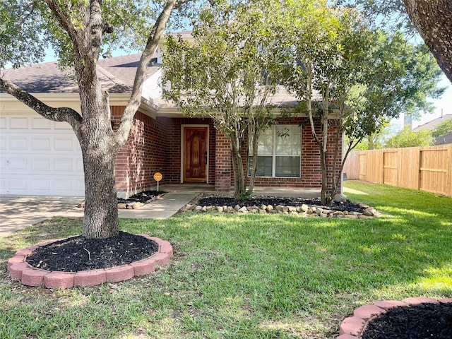 15318 Redbud Berry Way, Cypress, TX 77433 - view of front facade with brick siding, a front lawn, fence, and an attached garage