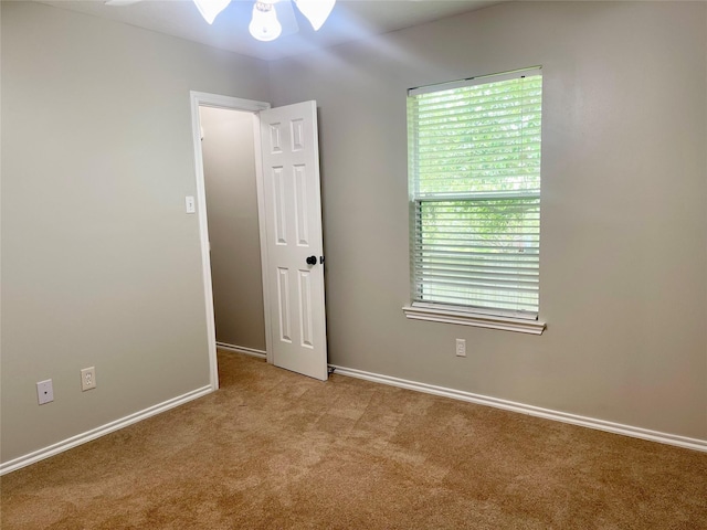 15318 Redbud Berry Way, Cypress, TX 77433 - carpeted spare room featuring ceiling fan, baseboards, and plenty of natural light