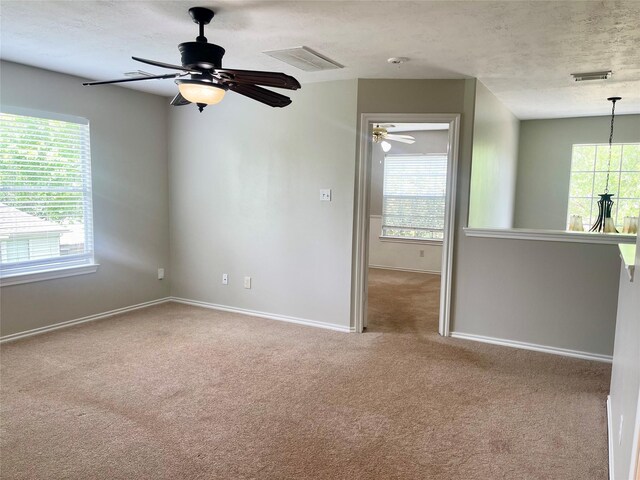 15318 Redbud Berry Way, Cypress, TX 77433 - carpeted empty room with ceiling fan, visible vents, and a wealth of natural light