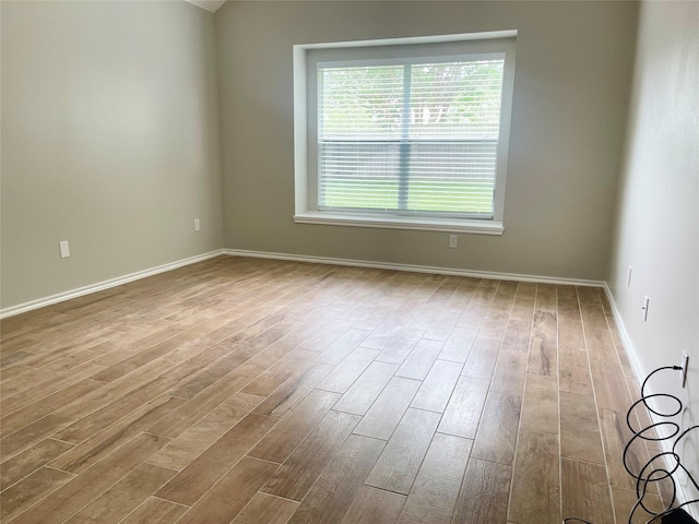 15318 Redbud Berry Way, Cypress, TX 77433 - spare room with a healthy amount of sunlight, wood finished floors, and baseboards