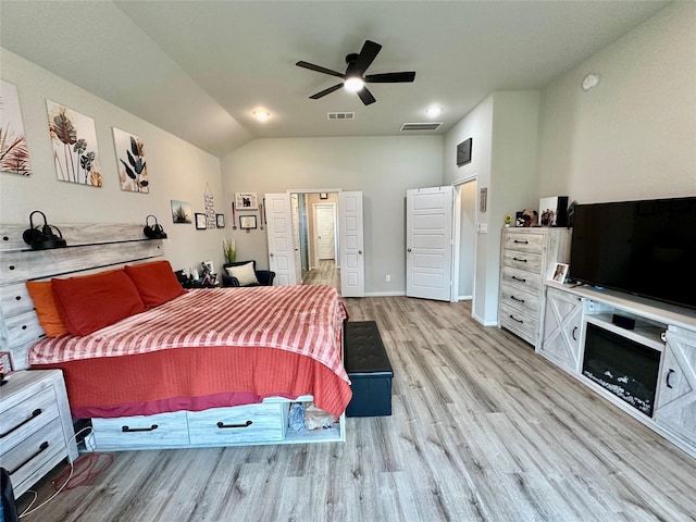 31503 Sandpiper Creek Dr, Hockley, TX 77447 - bedroom with light wood-style floors, vaulted ceiling, and a ceiling fan