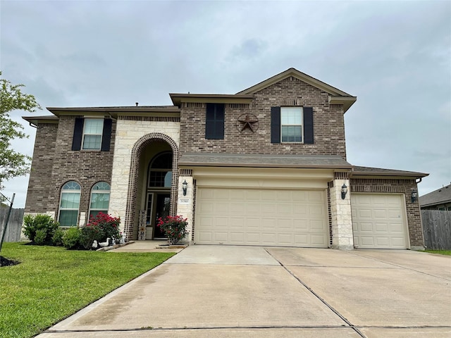 31503 Sandpiper Creek Dr, Hockley, TX 77447 - view of front of property with concrete driveway, brick siding, and an attached garage