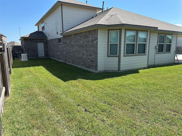 31503 Sandpiper Creek Dr, Hockley, TX 77447 - rear view of house with brick siding and roof with shingles