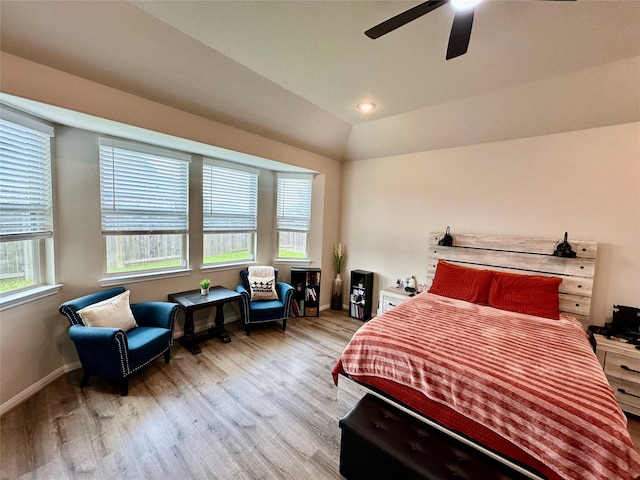 31503 Sandpiper Creek Dr, Hockley, TX 77447 - bedroom with light wood finished floors, multiple windows, baseboards, and lofted ceiling