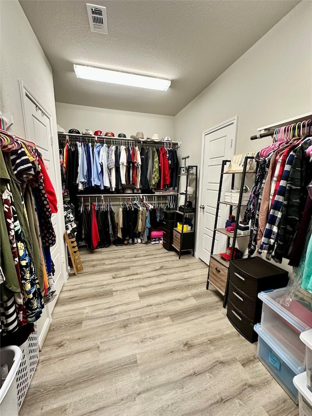 31503 Sandpiper Creek Dr, Hockley, TX 77447 - walk in closet with wood finished floors