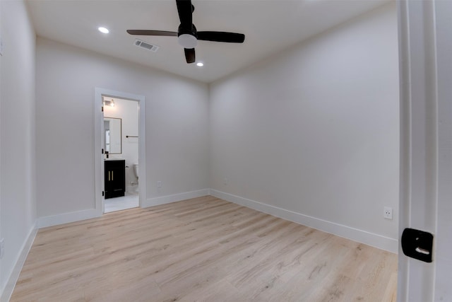 unfurnished room with a ceiling fan, visible vents, recessed lighting, wood finished floors, and baseboards