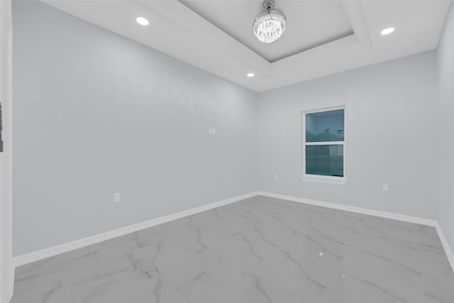 3007 E Ebano Ave, Hidalgo, TX 78557 - unfurnished room with marble look tile flooring, recessed lighting, a chandelier, and a raised ceiling