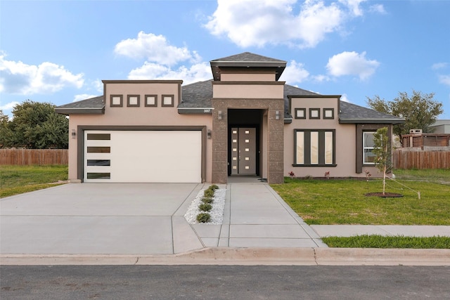 3007 E Ebano Ave, Hidalgo, TX 78557 - view of front facade featuring driveway, stucco siding, a garage, and a shingled roof