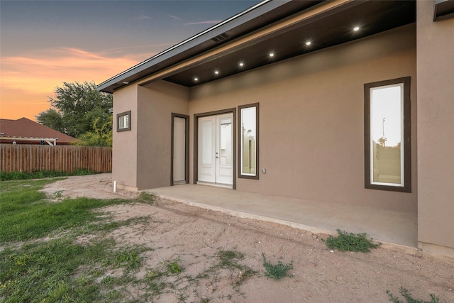 3007 E Ebano Ave, Hidalgo, TX 78557 - exterior entry at dusk with stucco siding