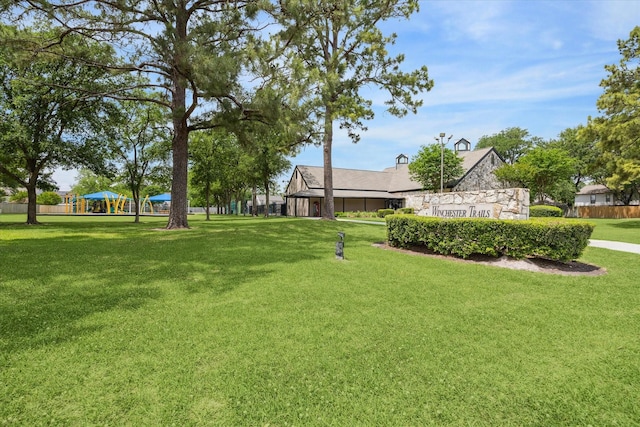view of yard with a playground and fence