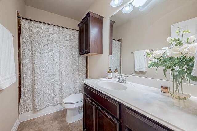 bathroom featuring toilet, vanity, and shower / bath combination with curtain