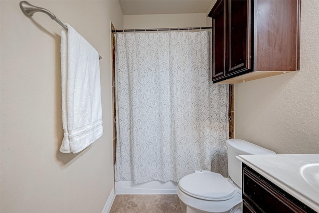 bathroom with shower / bath combo with shower curtain, vanity, and toilet