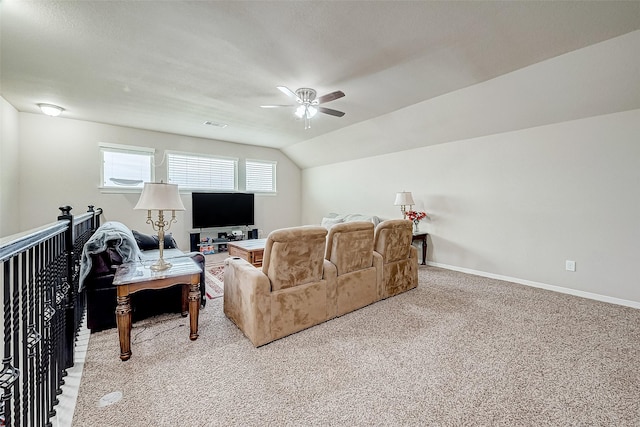 living room featuring visible vents, baseboards, a ceiling fan, vaulted ceiling, and light carpet