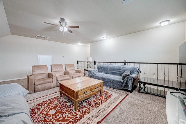 living area with visible vents, a ceiling fan, carpet flooring, and vaulted ceiling
