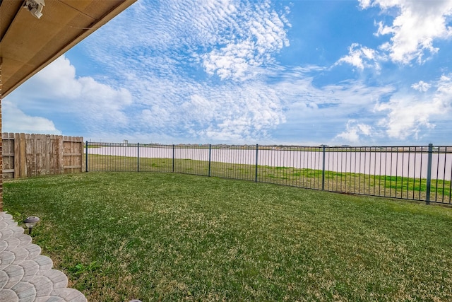 view of yard with a fenced backyard