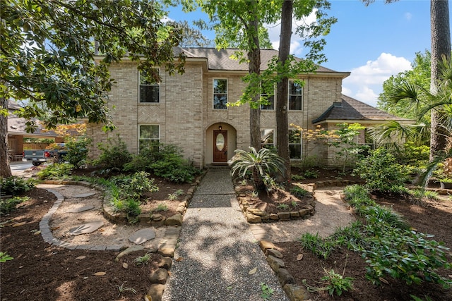 2503 Trail River Dr, Kingwood, TX 77345 - view of front of property featuring brick siding and a shingled roof