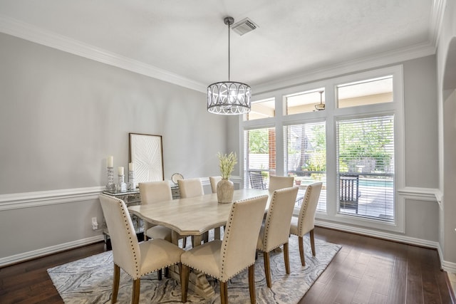 dining room featuring visible vents, an inviting chandelier, dark wood-type flooring, and crown molding
