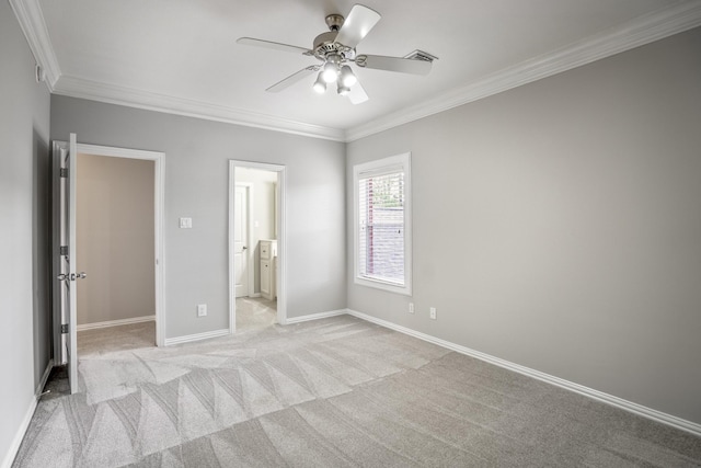 unfurnished bedroom featuring connected bathroom, light carpet, baseboards, ornamental molding, and visible vents