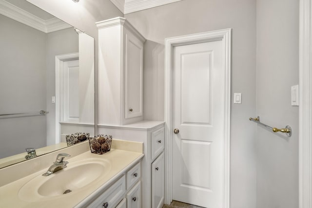 bathroom with crown molding and vanity